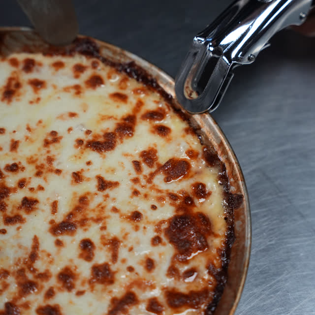 A lasagna coming out of the oven